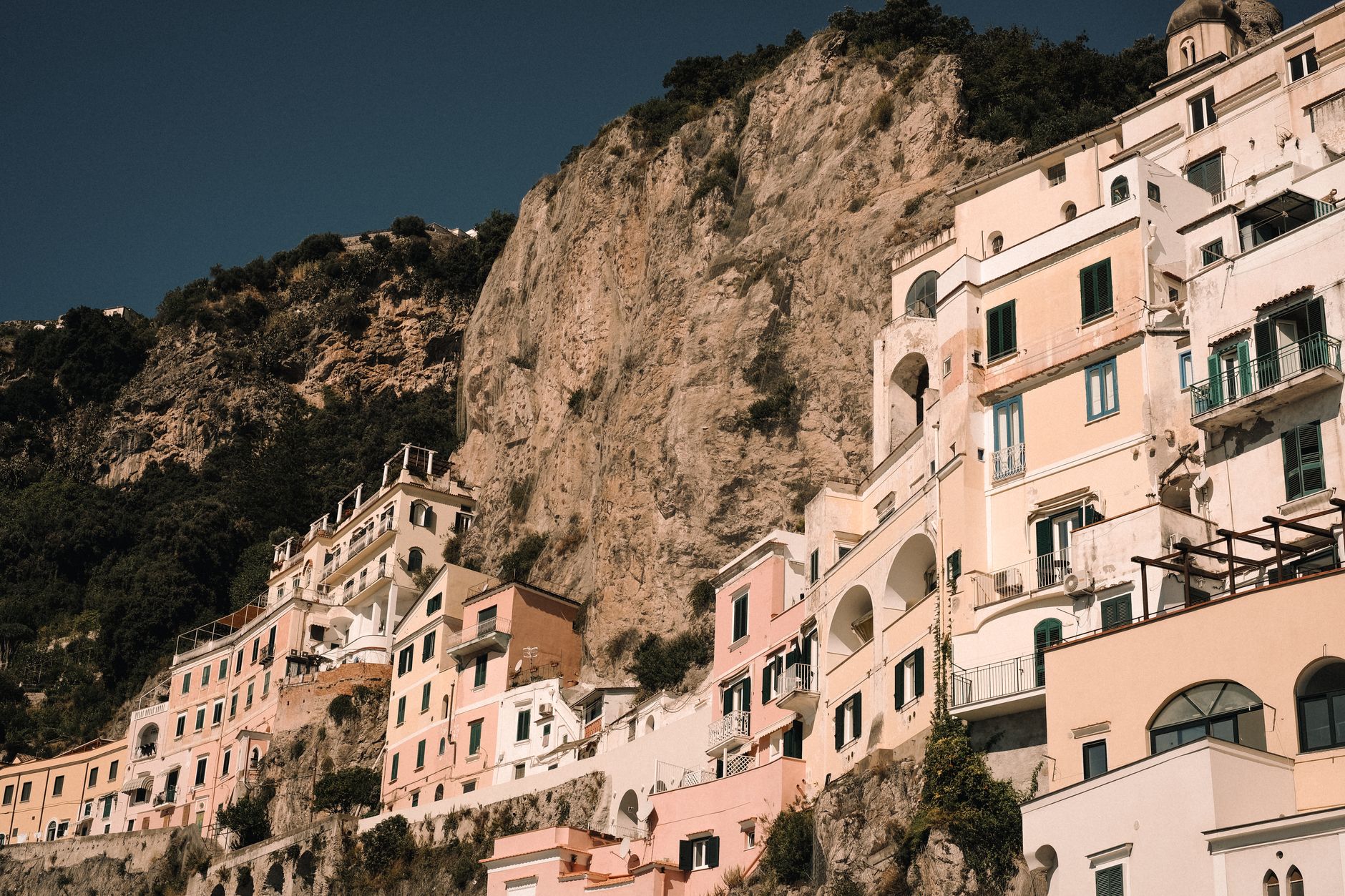 Panoramic view of the Amalfi coastline cliffs meeting the deep blue sea
